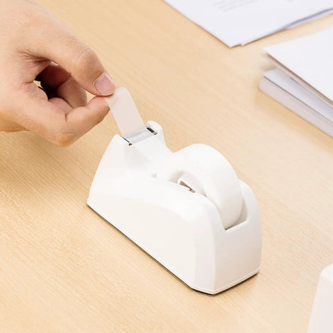 Solid Grip Invisible Tape With Smooth Matte Dispenser And Sixteen Heavy Duty Refill Rolls Zero Shine Finish Ideal For Paper Arts And Daily Tasks A Flat Out Winner in use, pulling tape from dispenser.