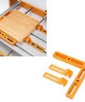 Rock Solid CNC Workpiece Positioning Fixture Kit With T Slot Perforated Table And Hella Accurate Woodworking Vise Clamps, featuring wood block and clamps.