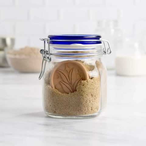 Terracotta Brown Sugar Saver Disc with Elegant Leaf Design keeping sugar fresh in a sealed container, 2 pack visible.