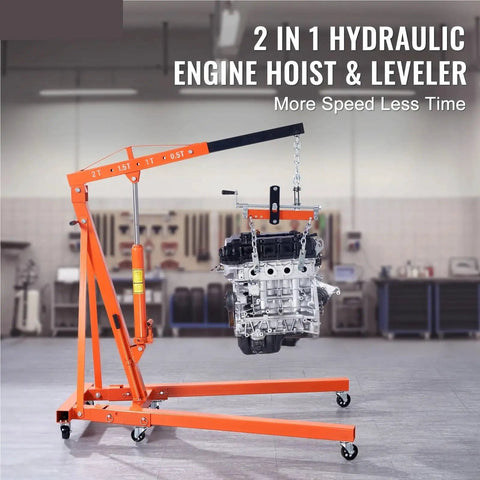 Heavy Duty Hydraulic Engine Hoist With Telescoping Lever Boom And Precision Leveler Base lifting an engine in a garage setting.