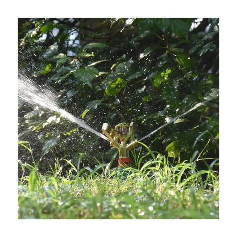 Tough As Nails Zinc Alloy Pulsating Sprinkler With 360 Degree Rotation watering lawn under trees