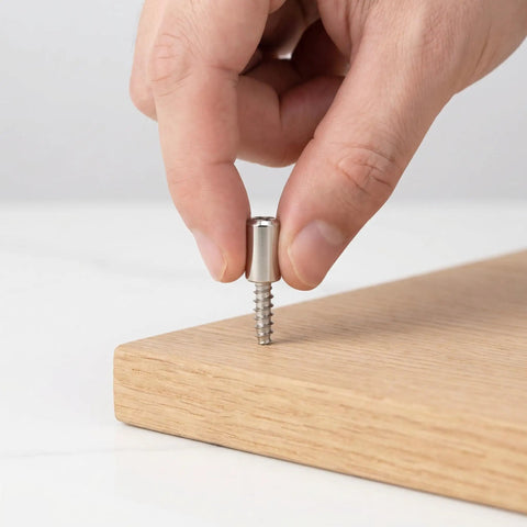 Inserting a screw from Heavy Duty Cabinet Shelf Peg Set With 150 Self Tapping Screws And 150 Sleeves for cabinets.