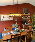 Rustic Modern Farmhouse Kitchen Island Light With Wood Panel Rectangular Frame 34 Inch Five Light Oil Rubbed Bronze Finish And Russet Oak Panels For Industrial Cozy Vibe in dining room setting above wooden table.