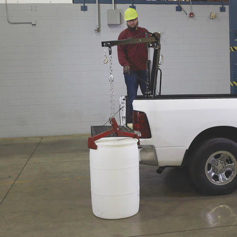Beast Mode Hydraulic Pickup Truck Crane With 360 Degree Pivot And Integrated Hand Winch Built Legit For Up To Two Thousand Pound Vehicle Load Towing lifting a barrel from a truck bed.
