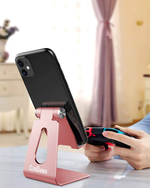 Adjustable Aluminum Phone Stand For All Phones With 270 Degree Tilt Case Friendly Clamp Desktop Dock Rose Gold holding smartphone on desk