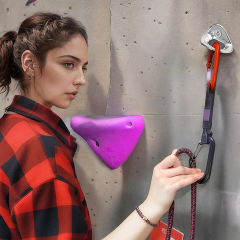 Climber using Beefy Stainless Steel Climbing Anchor Bolt Hangers 6 Pack 25kN Load Capacity for rock climbing setup.
