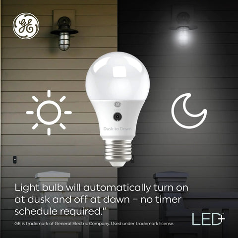 Smart Dusk To Dawn Outdoor LED Bulbs With Auto On Off For Porch Or Yard Daylight Color E12 Candelabra Base, shown lit outdoors.