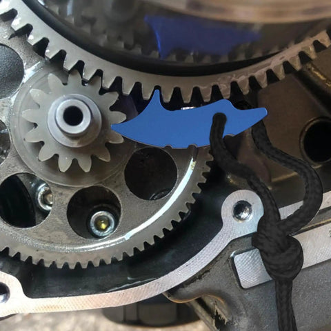 Close-up of Jammer Lock Tool For ATVs And Motorcycles securing transmission gears with aluminum magnetic device.