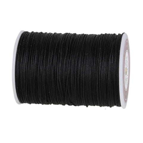 Rock Solid Waxed Thread For Leather Sewing And Bookbinding Hella Durable Half Millimeter Black Cord on a spool, ideal for handcraft projects.