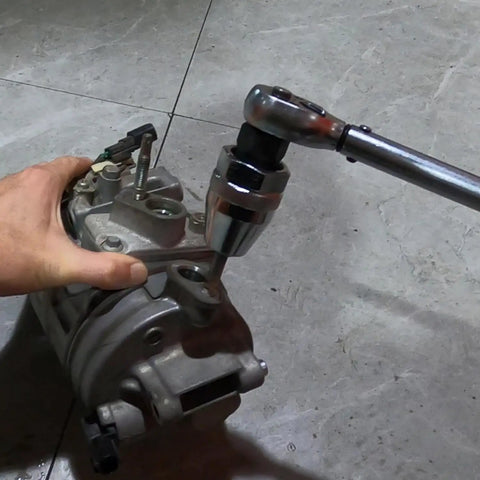 Damaged Bolt And Stud Extractor Tool For One Quarter Inch To One Half Inch Studs in use on rusted machinery with wrench
