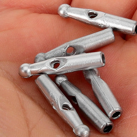Handy Dandy 10 Piece Umbrella Tail Beads Kit For Foldable Repair And Sturdy Plastic Rib End Caps Easy Snap Fix keeps your rain gear snappy and dry through any storm weather. Silver plastic caps in a hand.