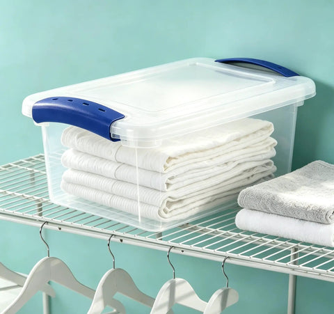 Pack Of Three 7 Quart Clear Plastic Storage Bins Featuring Heavy Duty Walls And Foolproof Snap Lock Lids To Keep Garage Or Desk Clutter Totally Under Control For Busy Mornings with folded towels.