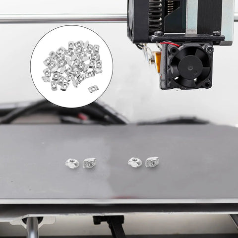 Get Your 3D Printer Building On Point With This Solid M3 Sliding T Slt Nut Kit, showing M3 T slot nuts on a printer bed.