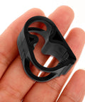 Close-up of one clamp from adjustable plastic tubing clamps set of 5 for water flow control, held in hand, showing black plastic material.