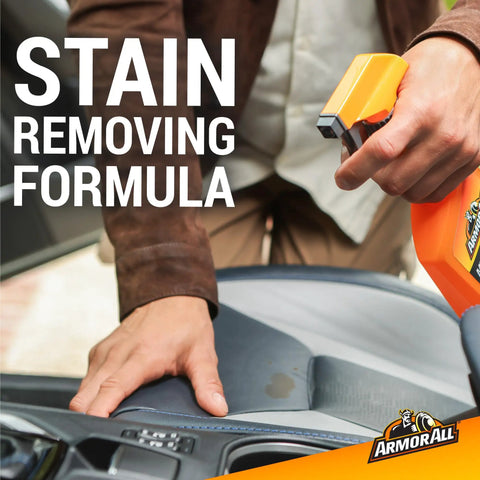 Get Your Ride Looking Sharp With This Multi Purpose Car Cleaner Spray In 16 Fl Oz Tossing New Car Scent Everywhere To Cut Through Dirt On Dashboards And Upholstery While Killing Stinks Dead, spray bottle in use on stained car seat.