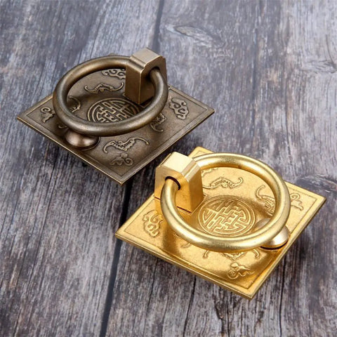 Antique Bronze Brass Cabinet Door Handle 2pc Set For Cabinets Drawers Cupboards With Chinese Drop Style Design on wood surface