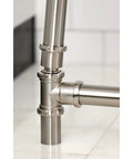 Close-up of brushed nickel finish, solid brass Tub Waste And Overflow Drain Assembly With Double Pivoting Action, Toe Touch Stopper.