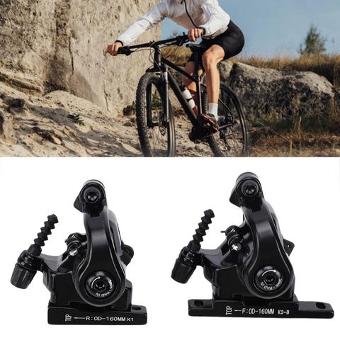 Heavy Duty Foldable Motorcycle Front Wheel Lift Scissor Stand With Secure Garage Wheel Chock For No Sweat Tire Jobs And Quick Chain Lube Compact Ride Ready Two Piece Set displayed with mountain biker.
