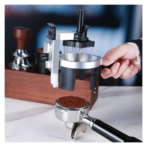 Badass Espresso Stirrer And Coffee Distribution Tool For Leveling Portafilter Pucks Smooth Rotate Design, close-up showing espresso grounds and tool.