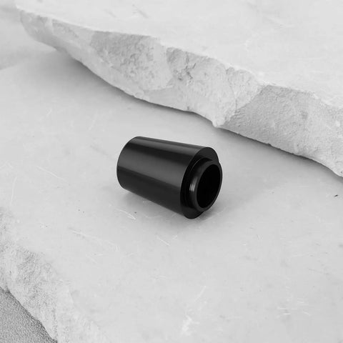 Four Pack 0.335 Inch Golf Club Shaft Ferrules for Titleist GT TSi TSR TS 1 2 3 4 and 910 913 Driver Models on stone surface