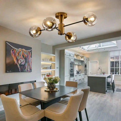 Modern Four Light Gold Glass Globe Ceiling Light Fixture Mid Century Semi Flush Mount in dining room with rustic vibe