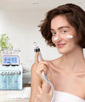 Woman using 6 In 1 Facial Machine For At Home Spa Grade Skin Care Device With Deep Cleansing Pore Tightening Hydration And Anti Aging Benefits