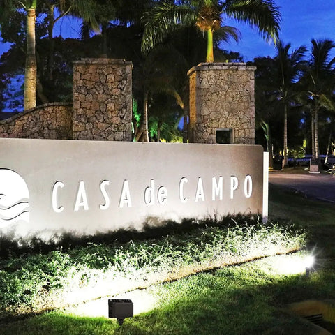 Stone entrance sign for Casa de Campo illuminated by 2 Pack 50W Outdoor LED Flood Lights With Dusk To Dawn Photocell, IP65 Waterproof