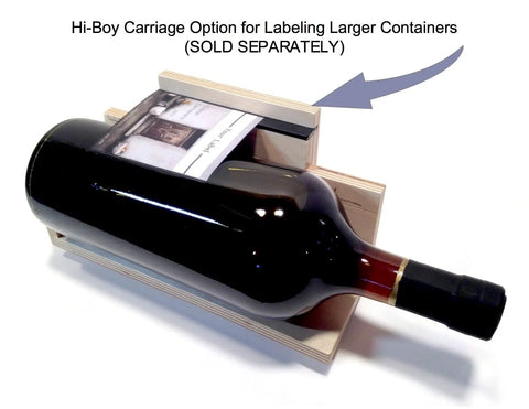 Hi-Boy Carriage Option for labeling larger bottles with a black wine bottle resting on a wooden device.