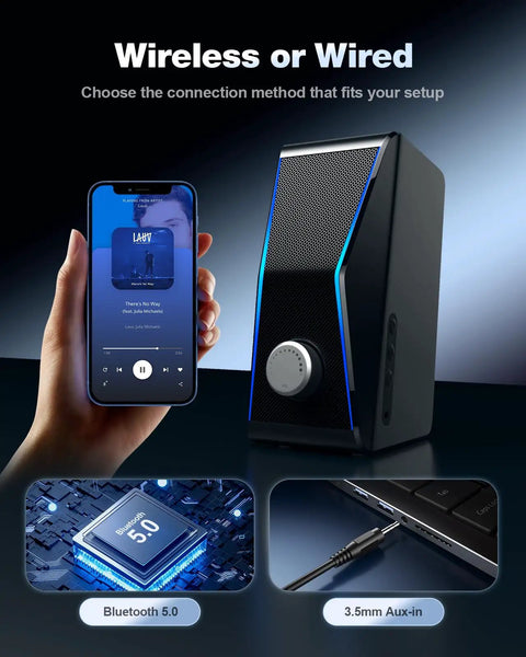 Dope Hi Fi PC Speakers With Bluetooth 5.0 And 3.5mm AUX Input beside a smartphone showing wireless music playback