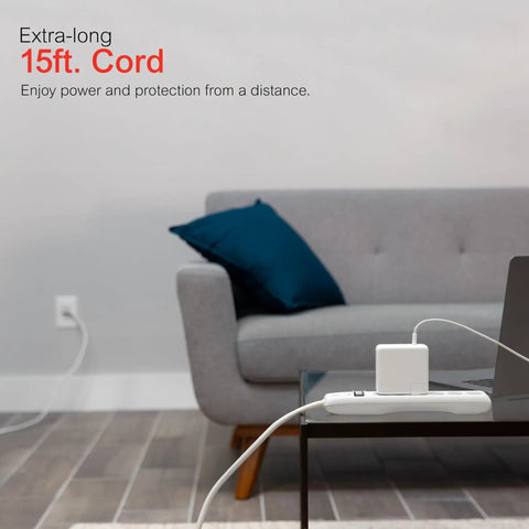 Living room with sofa, Long 15 Foot Heavy Duty Surge Protector Power Strip With Six Outlets Flat Plug 800 Joules connected.