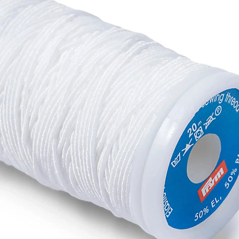 Super Stretchy White Elastic Sewing Thread For Knitting Crocheting And Machines 22 Yard Bobbin Spool close-up on white elastic thread.