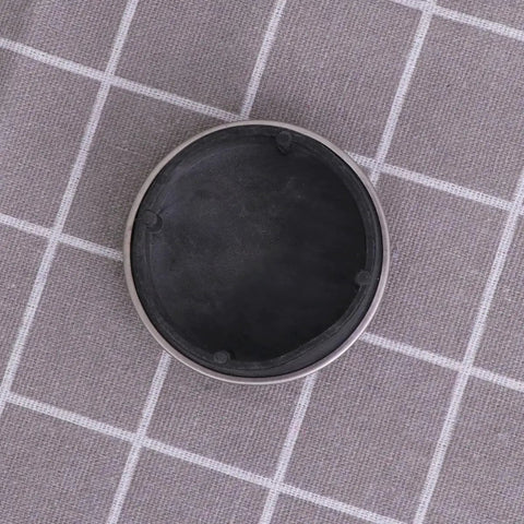 2pcs Rubber Bathtub Drain Stopper for Kitchen and Laundry Use, round black rubber plug with silver rim on a textured surface.