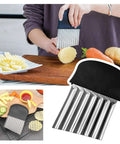 Crinkle cutter with stainless steel ribbed blade and ergonomic non-slip black handle for cutting potatoes and vegetables