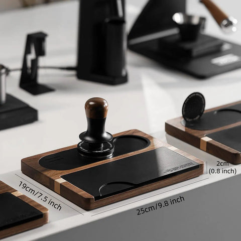 All In One Dope Espresso Tamping Station with Distributor and Tamper Holder in wooden gold finish on white countertop.