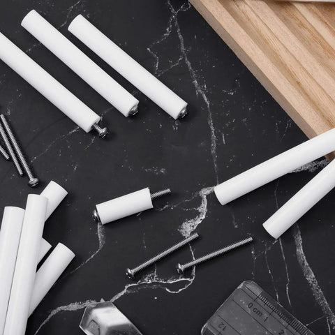 64 Piece Electrical Outlet Spacers And Box Extender Kit With Sixteen Three Inch Switch Spacers And Forty Eight Long One And One Half Inch Six By Thirty Two Flat Head Screws White For Quick Easy Fixes Of Wonky Or Sunken Outlets, shown with spacers and screws on black marble surface