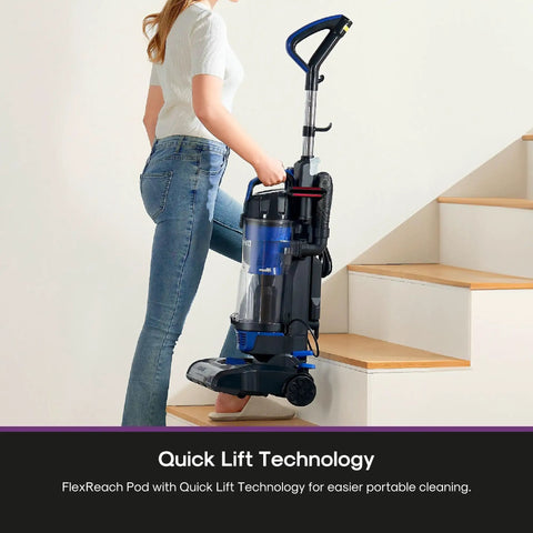Eureka PowerSpeed Lightweight Upright Vacuum Cleaner With Upgraded Cyclone System For Powerful Pickup On Carpet And Hard Floor Captures Large Debris Dirt And Microscopic Dust In Sleek Blue And Black New Model Design being carried on stairs with FlexReach Pod.