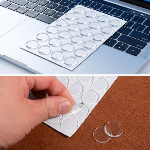 Clear Glass Table Top No Slip Pads 48Pcs Self Adhesive Rubber Bumpers 20mm By 2mm on laptop keyboard and being peeled off sheet.