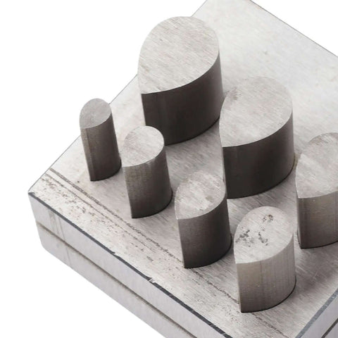 Punch Die Disc Cutter Set For DIY Jewelry Making, drop-shaped dies on steel base, close-up view of metal precision tool for gaskets