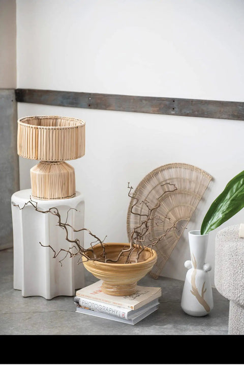 Hand Woven Banana Leaf Table Lamp With Natural Banana Fiber Shade And Iron Base on pedestal beside decor pieces