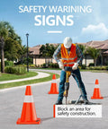 Worker using jackhammer surrounded by 12 pack 18 inch traffic safety cones with reflective collars, durable PVC construction.