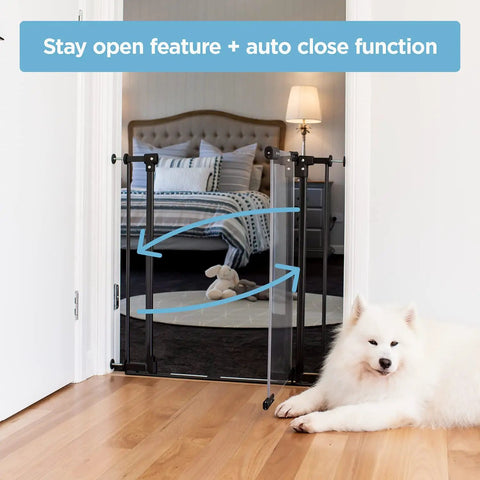 Clear Ultimate Baby Gate With Auto Close Walk Through No Fuss Safe Step Design Secure Handle Pressure Mounted Stairs Gate Warm Black Finish Fits Openings 44.5 To 48 Inches Includes 2x8 Extensions installed in bedroom doorway with dog nearby.