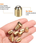 Premium 20 Pcs Ball Point Spring Plungers 12 Mm X 16 Mm Brass No Step Locking Pins showing hand holding multiple brass plungers.