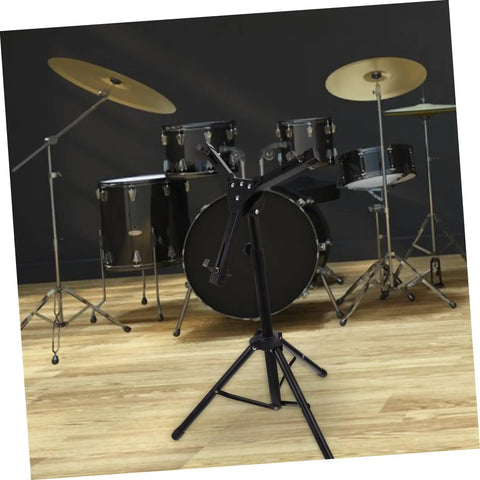 Heavy Duty Tripod Drum Stand And Snare Rack Holder Featuring Non Slip Base For Rock Solid Practice Routines In Sleek Black Finish, positioned in front of drum kit.