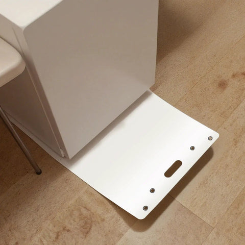Premium Appliance Moving Sliders With Pull Strap For Tile And Hardwood Floors shown on wooden floor, sliding under appliance.