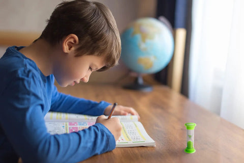 Child using Time Challenge Sand Timers Set Of Four Mini Hourglass Timers With 1 Minute 2 Minute 3 Minute And 5 Minute Durations for homework