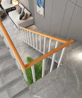 Solid Choice Stair Railing Spindles Side Mount Deck Porch Railing System No Fuss Install Includes Screws Kit Pre Drilled Handrail Posts For Balconies And Hallways 30 Pack 47 Inch view from above showing wooden handrail and white spindles on staircase.
