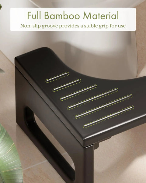 Close-up of 7 Inch Folding Toilet Stool For Adults Bamboo Rustic Brown Collapsible Poop Stool With Anti Slip Strip in bathroom