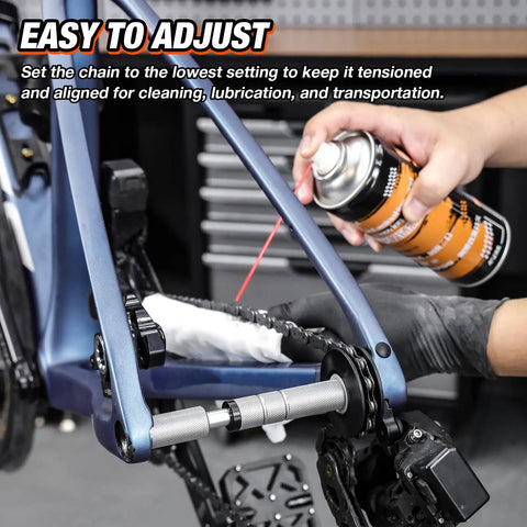 Person using Dummy Hub Bike Chain Holder For Thru Axle Frames with elastic snap fit on a bike, applying lubricant for cleaning.