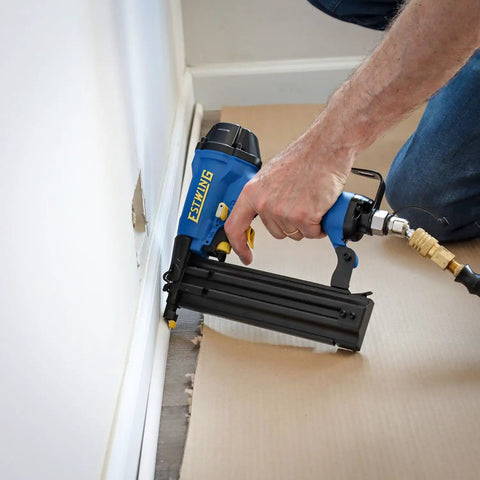 Pro Grade Pneumatic Brad Nailer Built Tough For Zero Stress Finish Work And Trim Install in use for trim work.