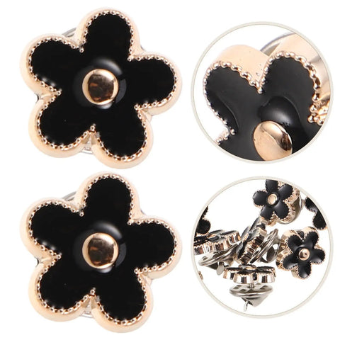 Twenty Piece Black Flower Snap Buttons Slick Metal Clip On Fasteners For Apparel Repairs with stylish black flower design and gold trim.